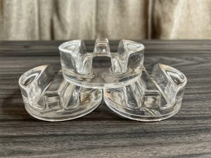 Glass Fermentation Weights with handles being displayed to show the differences.